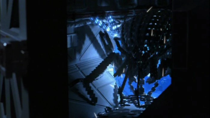 Un Réplicateur sous forme d'araignée mécanique
